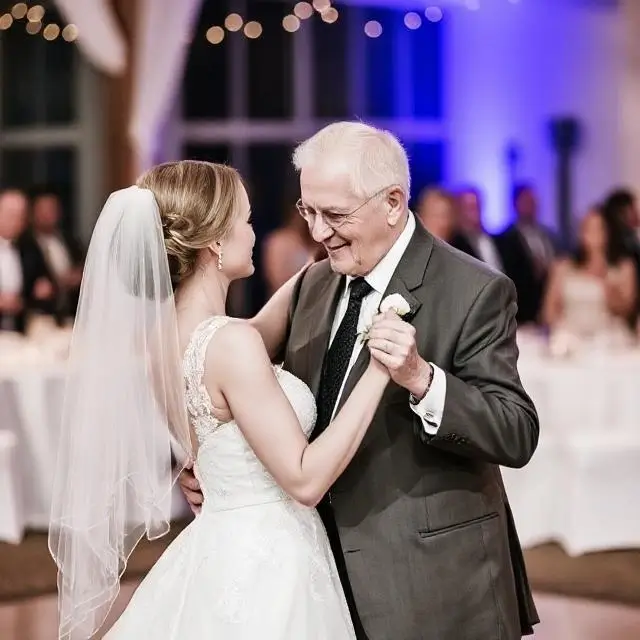 A bride and her father sharing a dance.
