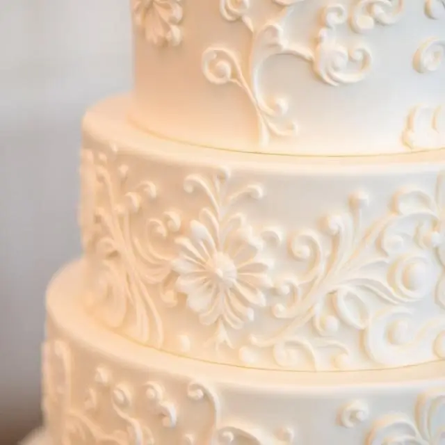 A close-up of an intricate wedding cake design.
