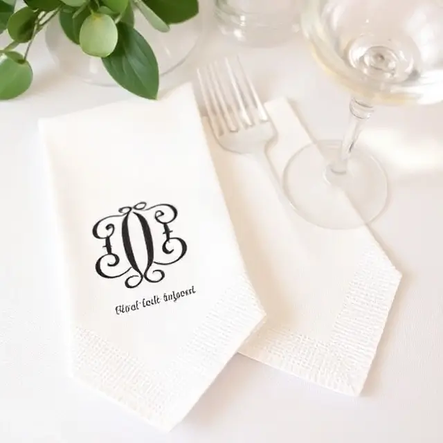 Custom cocktail napkins with a couple's monogram.