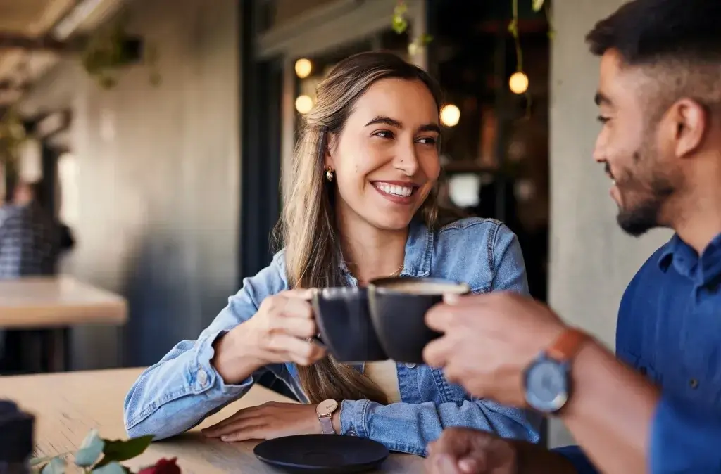 Couple discussing plans over coffee.