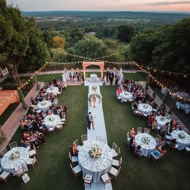 Aerial view of a stunning outdoor wedding reception.